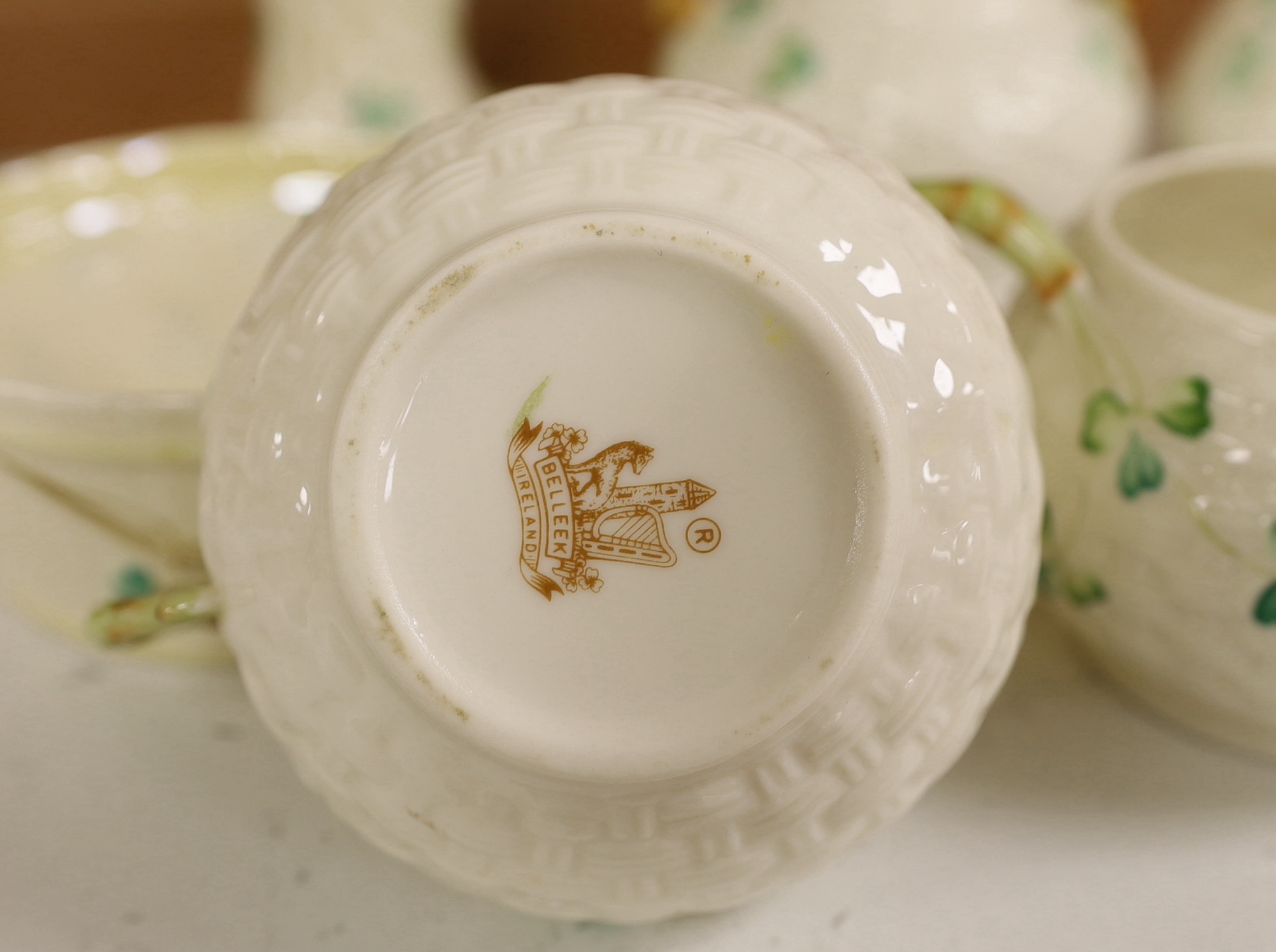A quantity of Belleek ‘Clover’ pattern ceramics and a Belleek box and cover, tallest 18.5cm